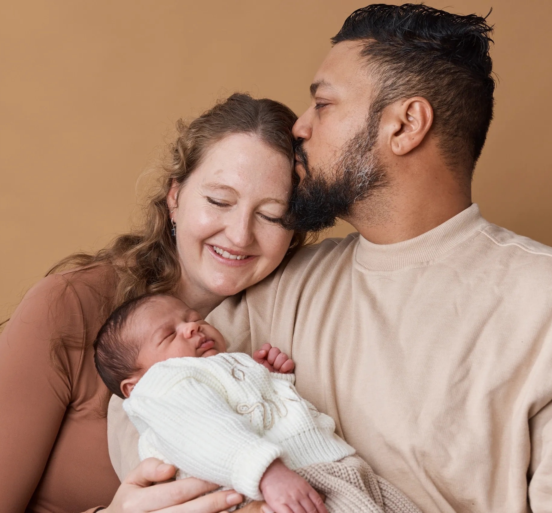 Parent holding newborn baby
